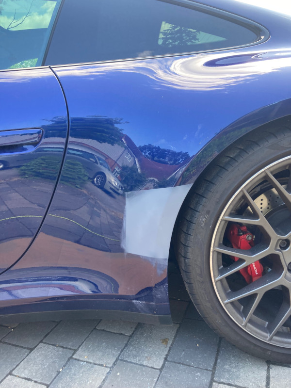 Dent removed from Porsche 911 rear quarter panel